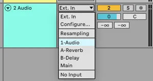 Ableton Live track I/O area on Audio 2 showing the Audio From dropdown open with options Ext. In, Configure..., Resampling, 1-Audio (highlighted), A-Reverb, B-Delay, Main, No Input.