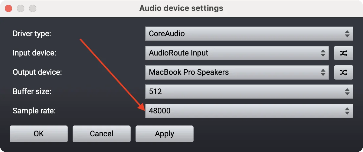 Acoustica's Audio device settings dialog showing Driver type: CoreAudio, Input device: AudioRoute Input, Output device: MacBook Pro Speakers, Buffer size: 512, Sample rate: 48000 (highlighted with a red arrow)